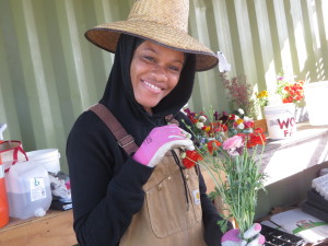 WOW Intern Muna creating CSA bouquets